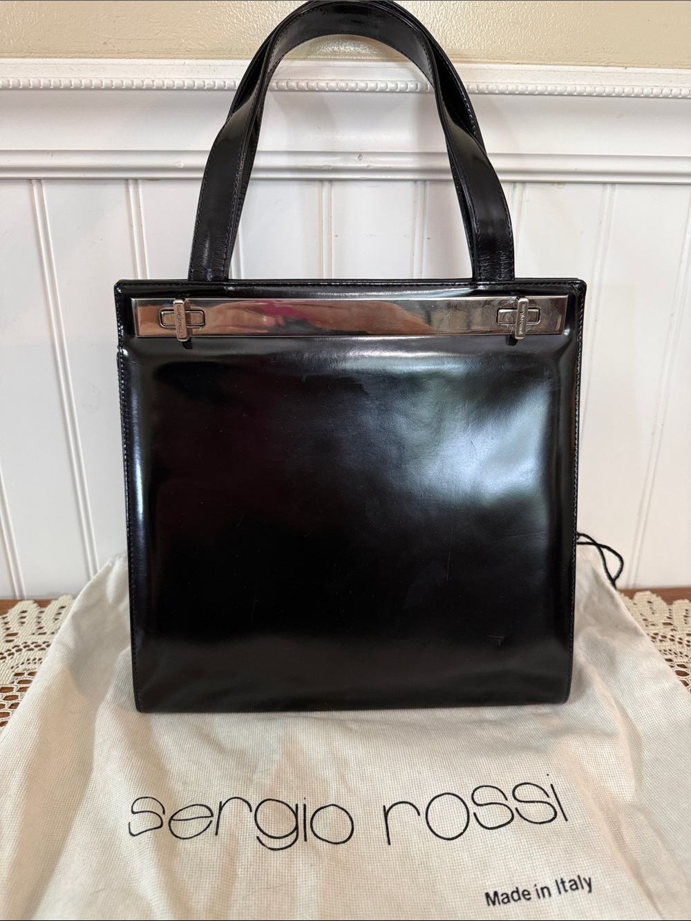 Sergio Rossi patent leather shoulder bag w/silver-tone metal top handle bar. GUC